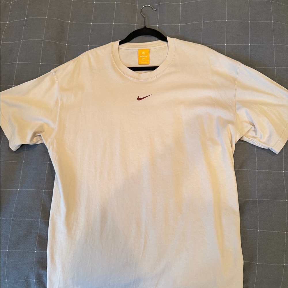 Nike Men's Off-White Tee with Maroon Logo